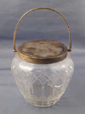 Appraisal: A sterling silver mounted cut glass biscuit barrel with swing