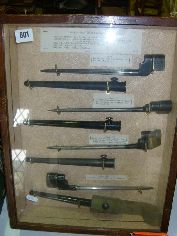 Appraisal: A collection of British WWII bayonets in glazed display case