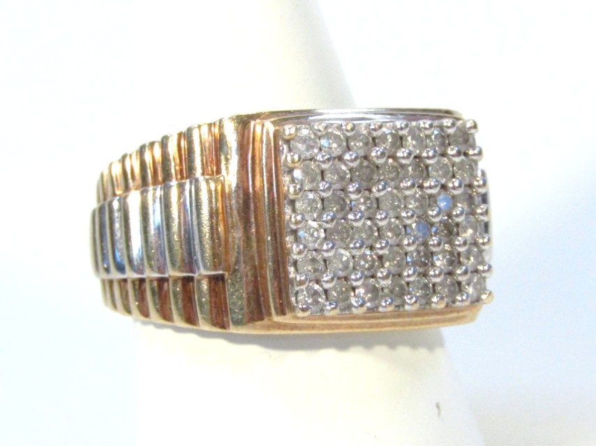 Appraisal: A gentleman's dress ring set with a geometric arrangement of