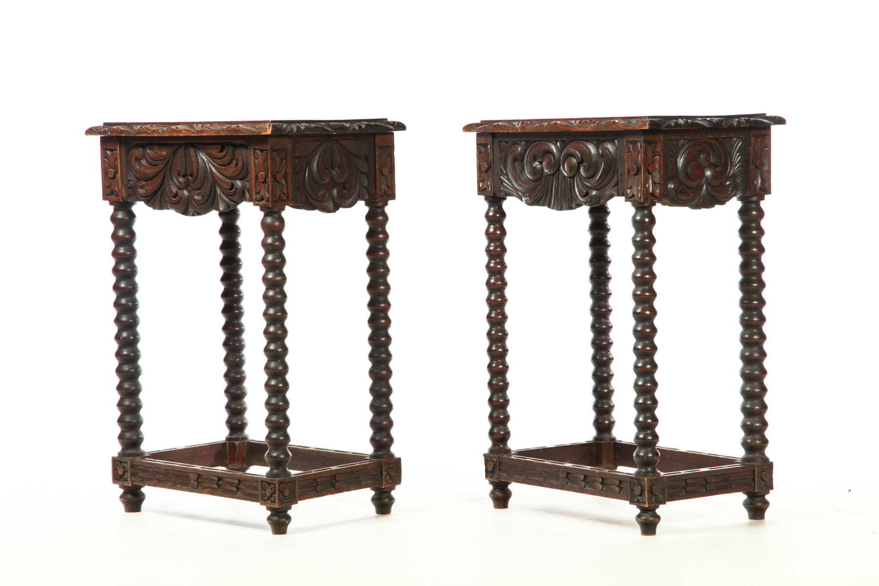 Appraisal: PAIR OF CARVED END TABLES Twentieth century mahogany Turned legs