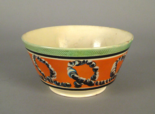 Appraisal: Mocha bowl th c with earthworm decoration on an orange