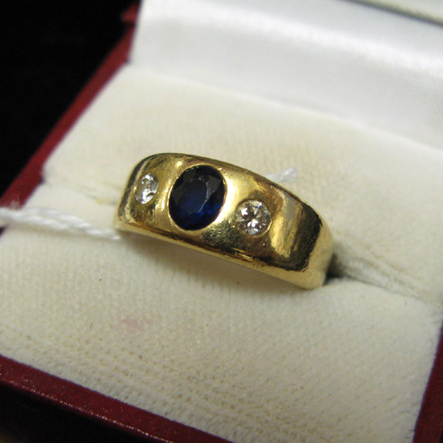 Appraisal: DIAMOND BLUE SAPPHIRE AND EIGHTEEN KARAT GOLD RING The tapered