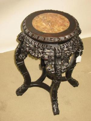 Appraisal: AN ORIENTAL CARVED PADOUK WOOD JARDINIERE STAND of circular form