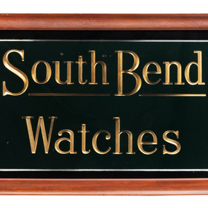 Appraisal: A Reverse Paint and Parcel Gilt South Bend Watches Advertising