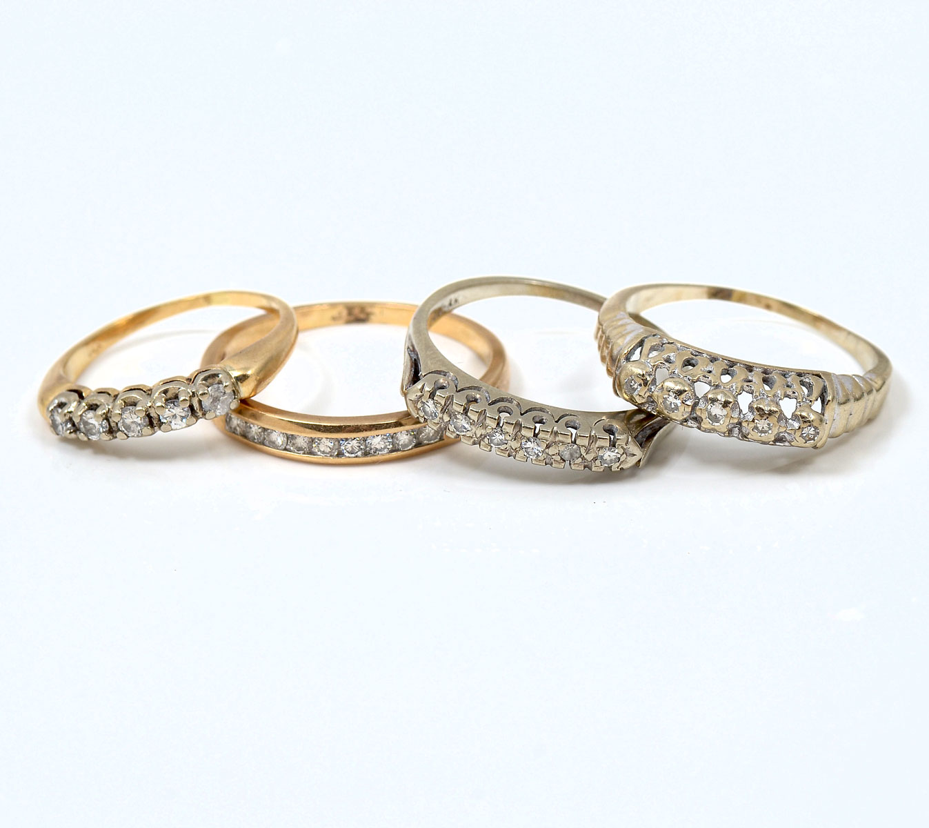 Appraisal: K GOLD DIAMOND BANDS Lot of four K white and