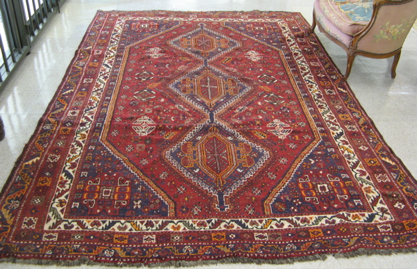 Appraisal: PERSIAN SHIRAZ CARPET Fars province south central Iran the brownish-red