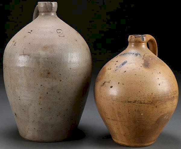 Appraisal: TWO EASTERN STONEWARE JUGS RD QUARTER TH C TWO EASTERN