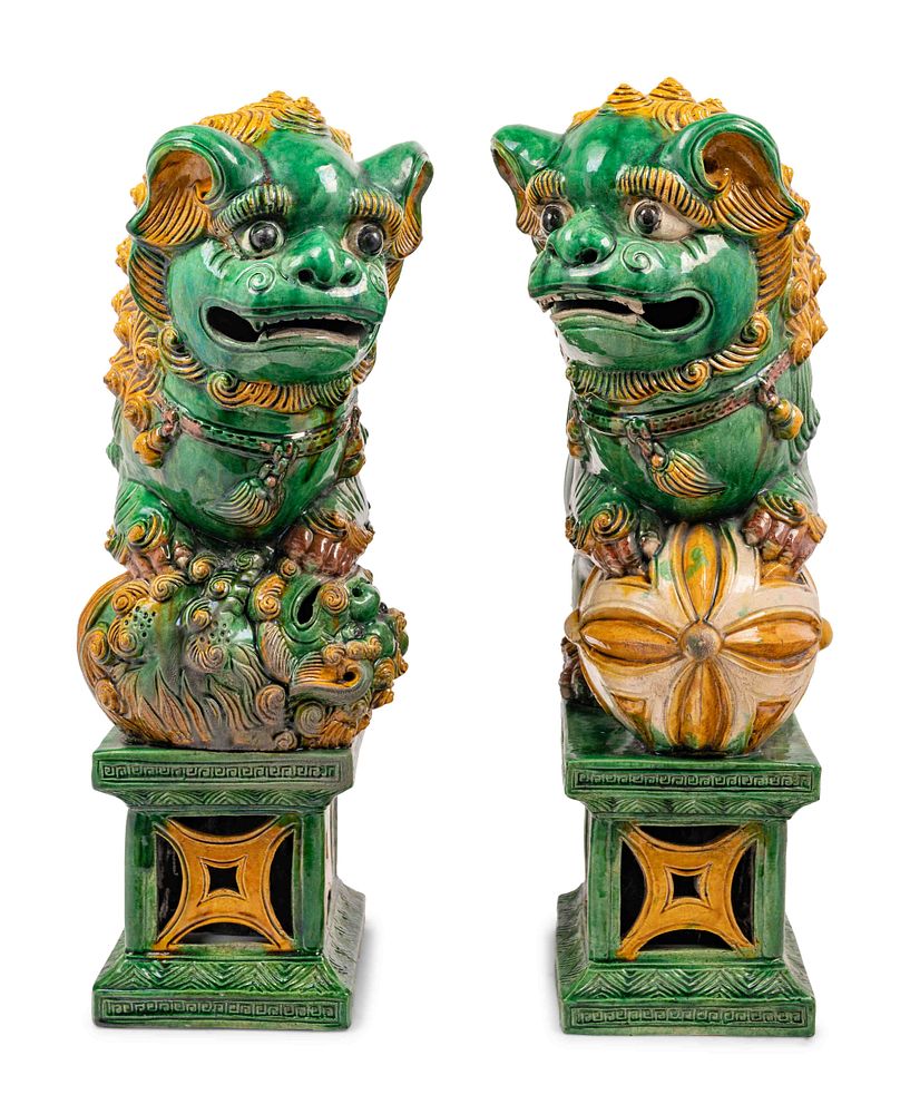 Appraisal: A Pair of Chinese Sancai Glazed Porcelain Figures of Fu