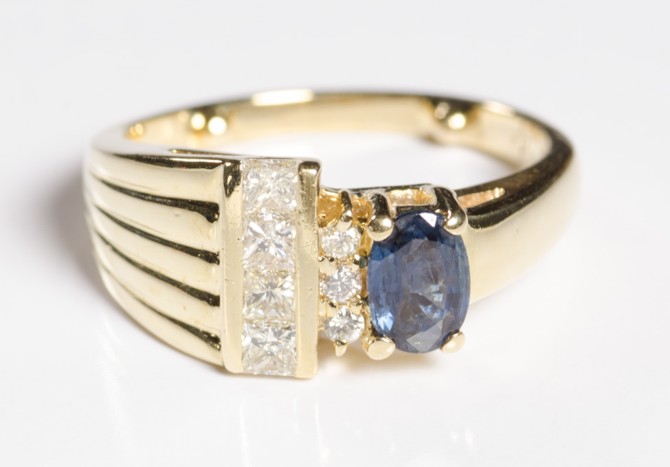 Appraisal: DIAMOND BLUE SAPPHIRE AND FOURTEEN KARAT GOLD RING set with