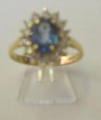 Appraisal: A SAPPHIRE AND DIAMOND CLUSTER RING the pale oval cut