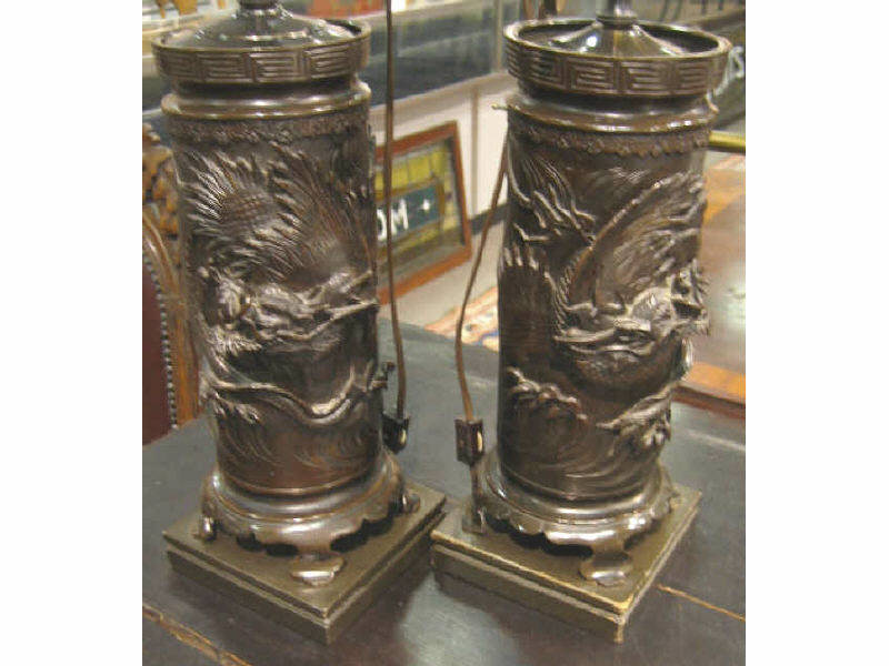 Appraisal: PAIR ASIAN CYLINDRICAL BRONZE LAMPS Asian footed vases with Greek