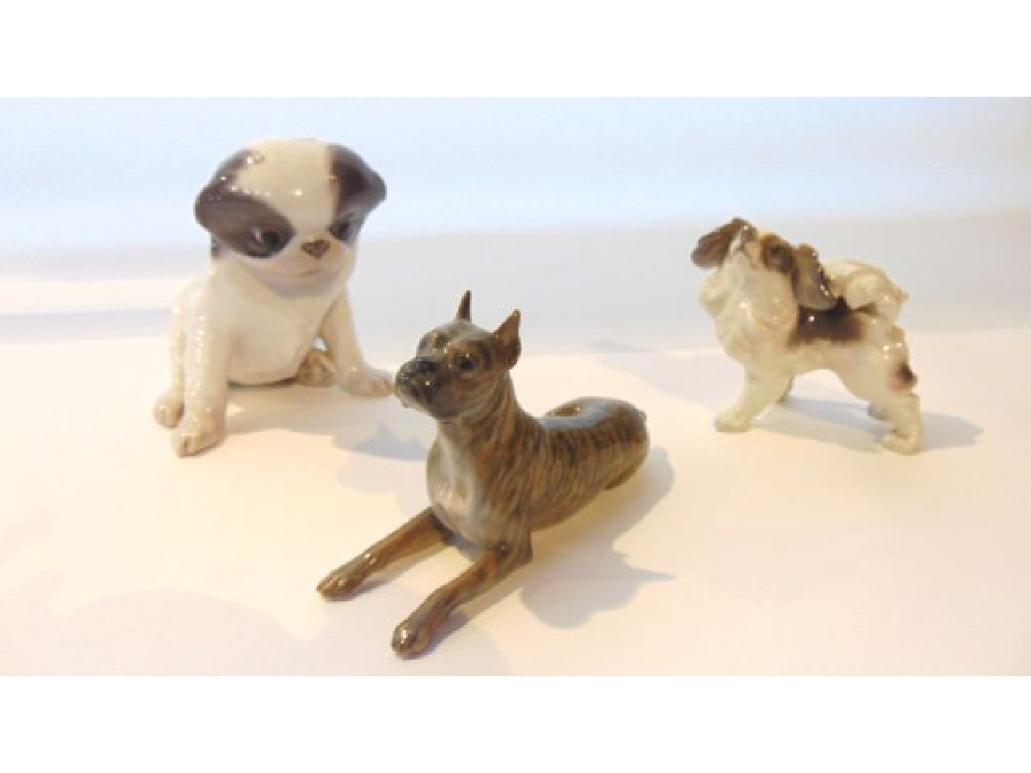 Appraisal: A collection of three Royal Copenhagen models of dogs comprising