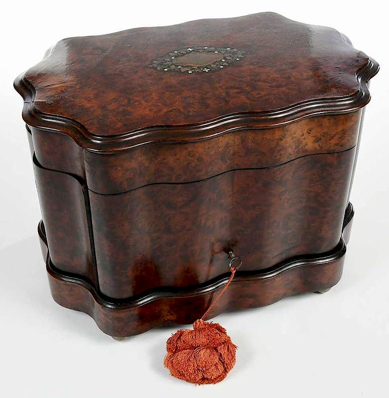 Appraisal: Serpentine Inlaid Burlwood Tantalus British th century bookmatched figured walnut