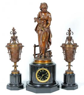 Appraisal: Louis XVI style patinated bronze and black marble figural clock