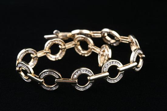 Appraisal: K YELLOW GOLD AND DIAMOND BRACELET ring-form links each set