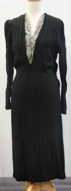 Appraisal: Dinner dress in black rayon crepe with inserted floral detail