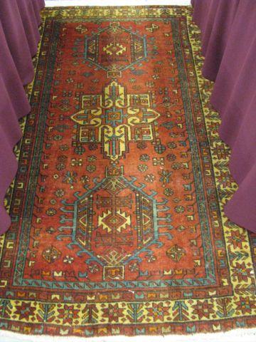 Appraisal: Heriz Persian Handmade Rug triple geometric designs on red field