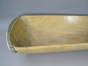 Appraisal: A wooden dough trough the ends with metal banded reinforces