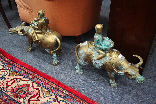 Appraisal: A PAIR OF ORIENTAL POSSIBLY BRASS SCULPTURES OF FIGURES with