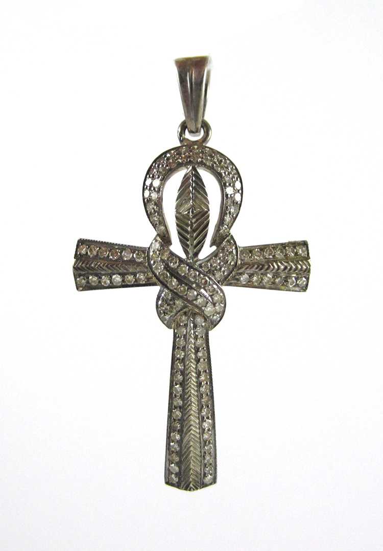 Appraisal: DIAMOND AND SILVER CROSS PENDANT covered with round-cut diamonds together