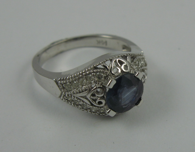 Appraisal: SAPPHIRE DIAMOND AND K WHITE GOLD RING centering a round-cut