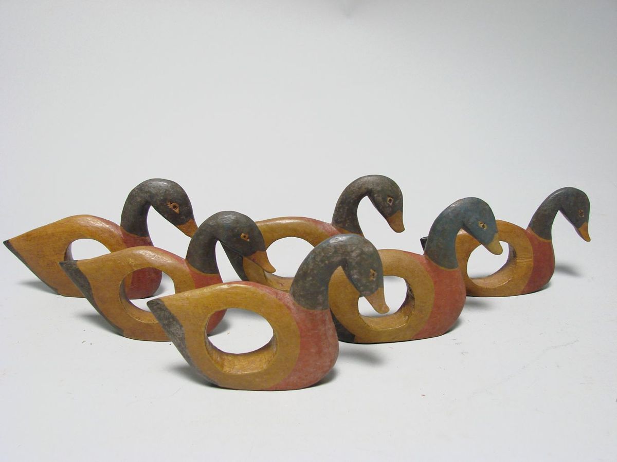 Appraisal: COLLECTION OF SIX CARVED WOODEN NAPKIN RINGS In the form