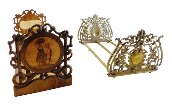 Appraisal: Two book racks one elaborately pierced brass rack with shield