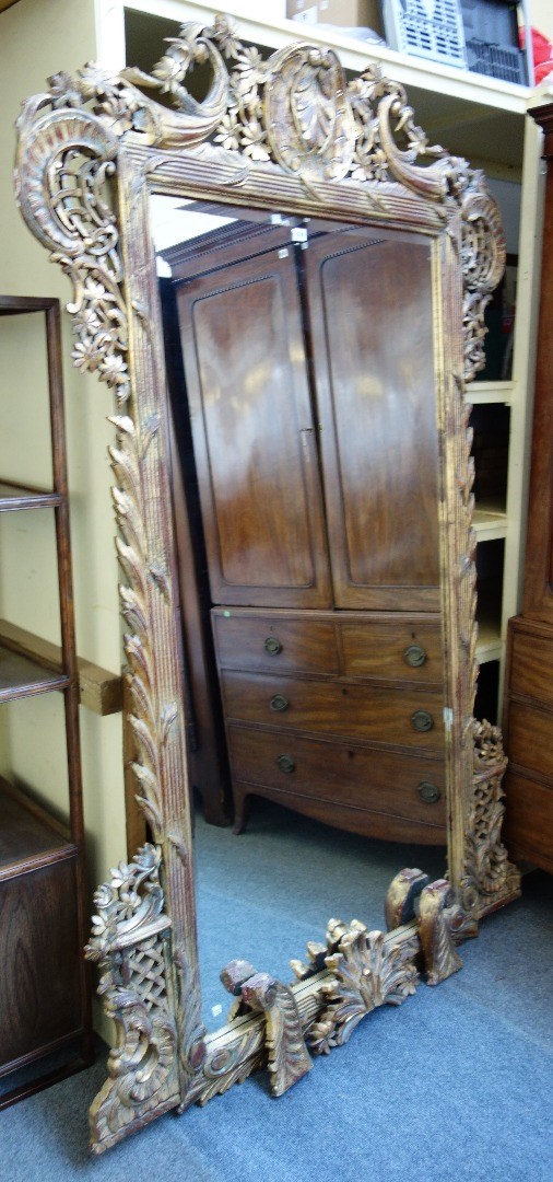 Appraisal: A large th century gilt framed wall mirror with pierced