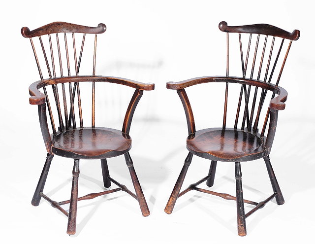 Appraisal: A pair of Arts and Crafts Windsor armchairswith curved backs