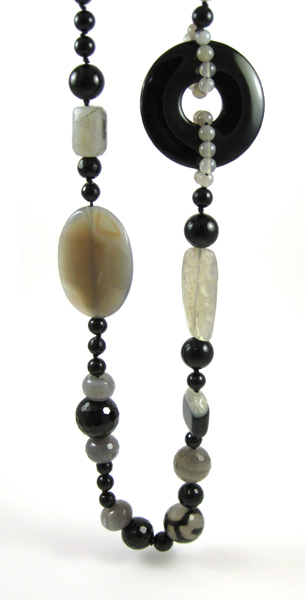 Appraisal: BLACK AND GREY AGATE NECKLACE measuring inches in length strung