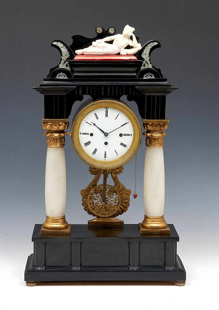 Appraisal: French pillar clock with recumbent figure French pillar clock with