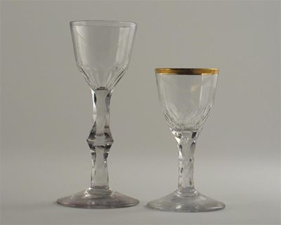 Appraisal: Two wine glasses with faceted stems one with a gilded