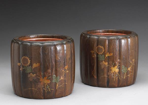 Appraisal: A pair of lacquer decorated kiriwood hibachi Each cylindrical body