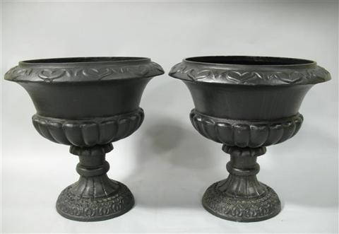 Appraisal: PAIR OF BLACK PAINTED GARDEN URNS Of campagna form with