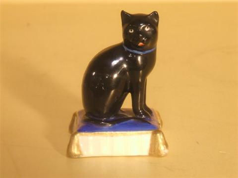 Appraisal: STAFFORDSHIRE MODEL OF A BLACK CAT Late th century modeled