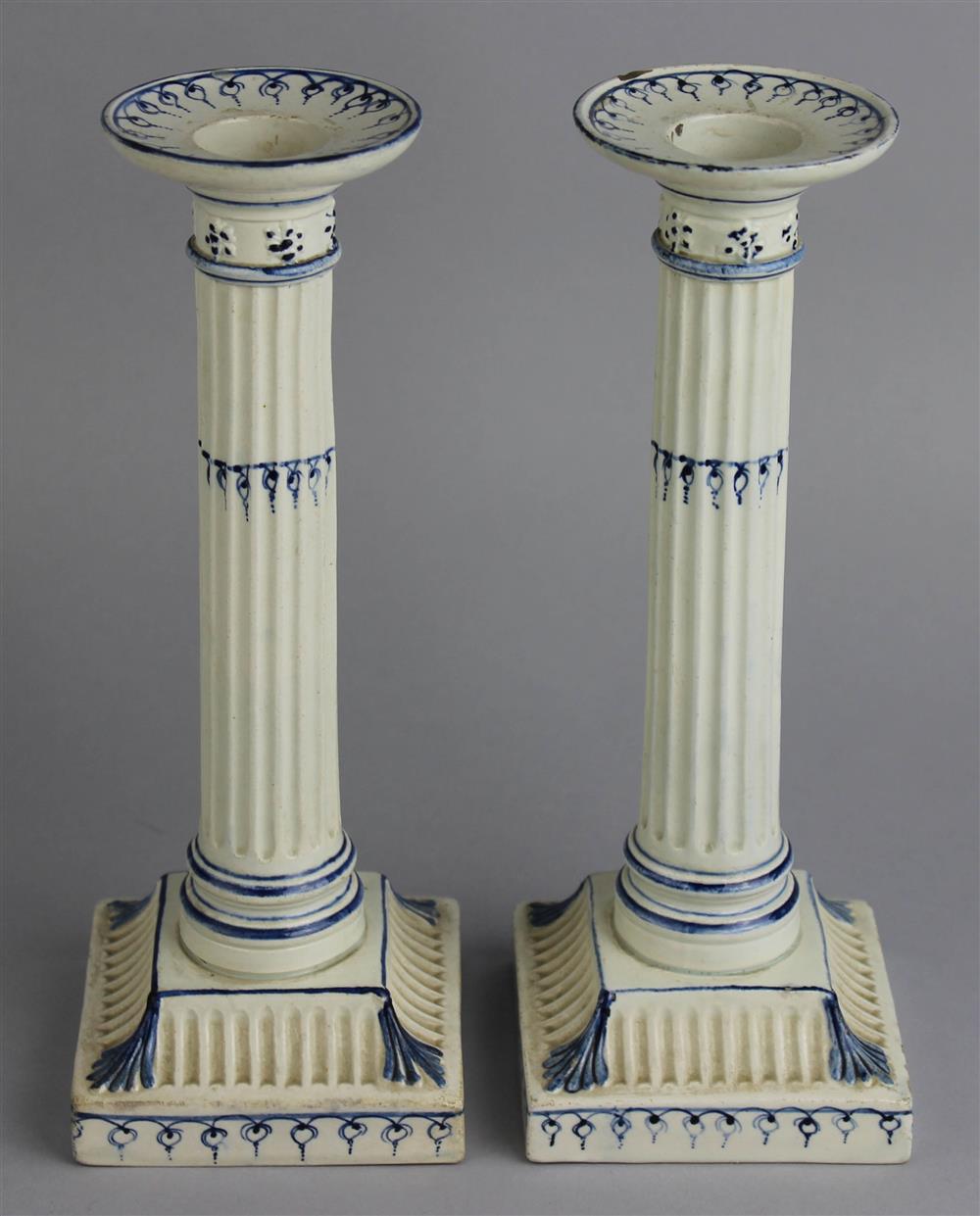 Appraisal: PAIR OF WEDGWOOD QUEENSWARE BLUE AND WHITE CANDLESTICKS early th