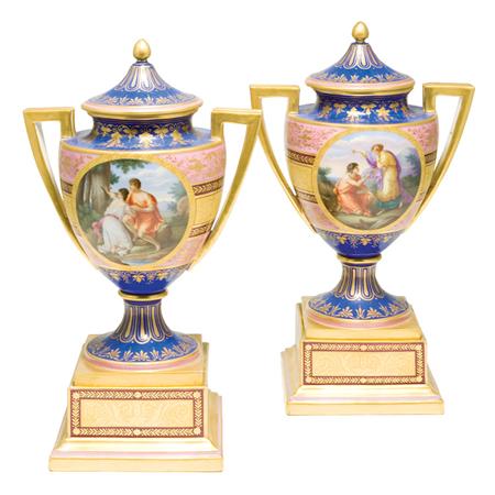 Appraisal: Pair of Vienna Porcelain Urns Estimate -