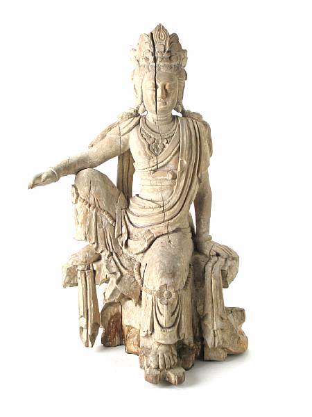 Appraisal: A Chinese carved and limed wood statue of a Guanyin