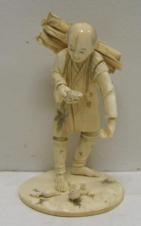 Appraisal: CARVED IVORY FIGURE OF FARMER Carrying a bundle of wood