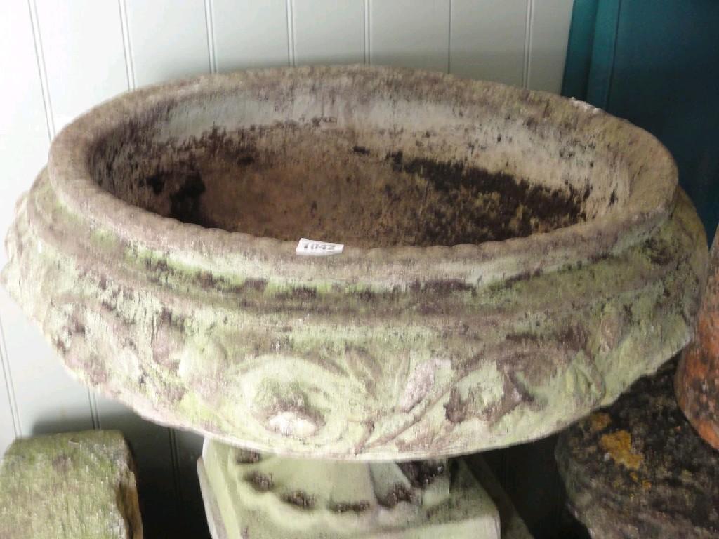 Appraisal: A weathered composition stone garden urn the shallow circular bowl