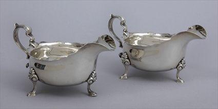 Appraisal: PAIR OF ENGLISH SILVER TRIPOD SAUCE BOATS Marks for C