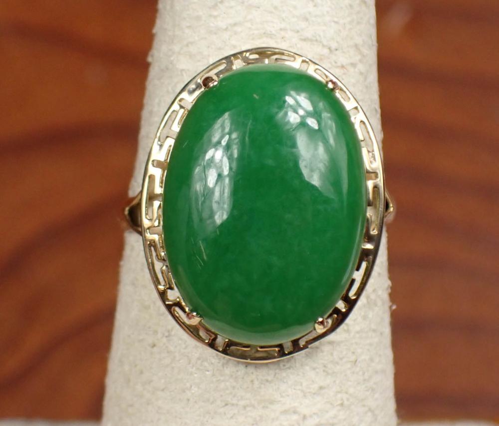 Appraisal: GREEN JADE AND FOURTEEN KARAT GOLD RING The yellow gold