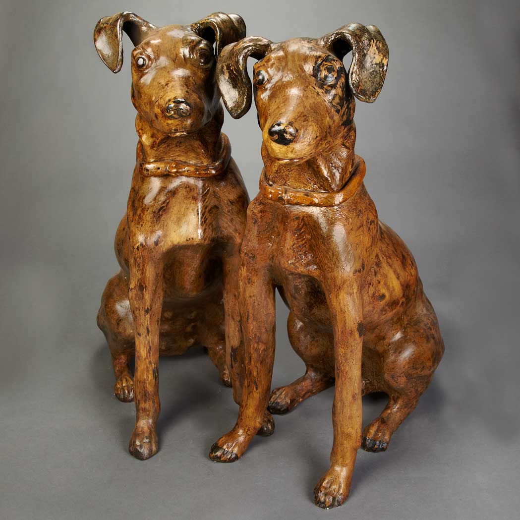 Appraisal: Companion Pair of Painted Ceramic Figures of Dogs th Century