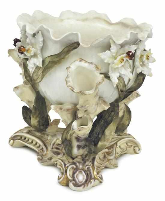 Appraisal: A MOORE BROTHERS FIGURAL PORCELAIN CENTREPIECE CIRCA The central spherical