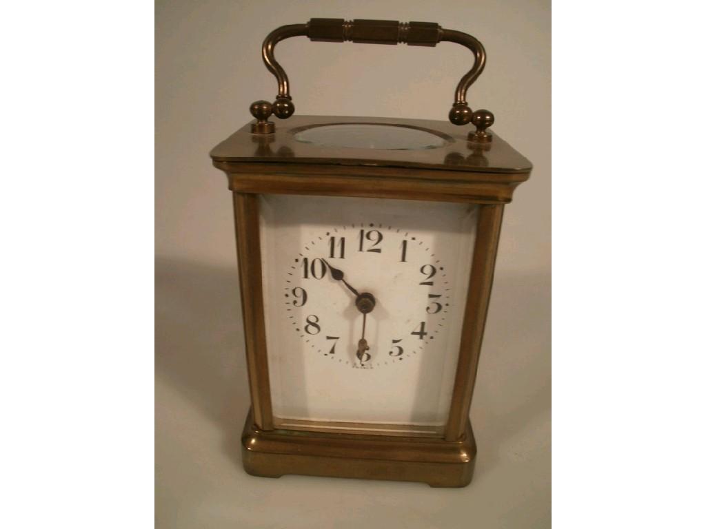 Appraisal: A brass-cased carriage clock with plain white enamel dial and