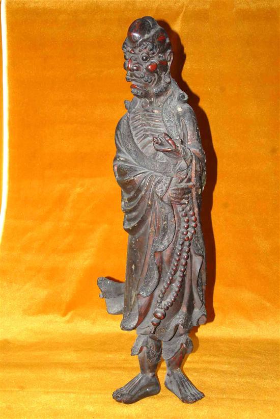 Appraisal: STANDING CARVED ORIENTAL FIGURE th C Scholar holding beads H