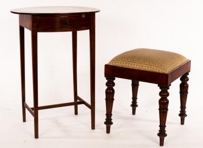 Appraisal: An oval mahogany side table fitted a drawer on square