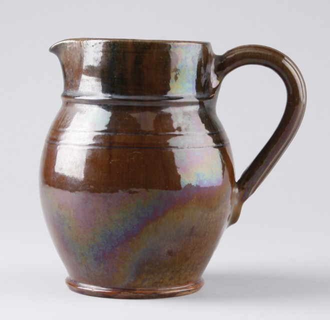 Appraisal: Redware pitcher features brown glaze with band decoration t marked