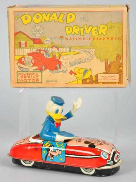 Appraisal: Tin Marx Disney Donald the Driver Wind-Up Toy Description American