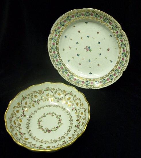 Appraisal: A circular dish with gilded scalloped border painted grapes and